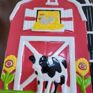 ceramic cow barn plaque hole on top to hang bright colors. By loomco